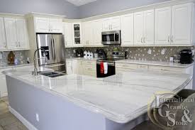 We see color variations from differing mineral content in the rock. White Quartzite Kitchen Countertops In Fort Myers Fl