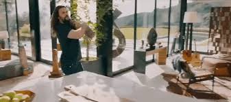 The opening scene shows him driving and talking. Jason Momoa Removes His Shoes Muscles And Hair At Home In Hilarious Rocket Mortgage Super Bowl Ad