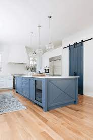 Natural elements with some pops of color as well as a visit to the dark side with colors you might never expect. 15 Blue Kitchen Islands Their Paint Colors In 2021 Blue Kitchen Island Modern Farmhouse Kitchens Barn Kitchen