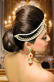 A Lower Elegant Bun Hairstyle For Your Wedding