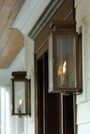 In most front door and entry areas, your outdoor sconces and wall lights should be positioned so that the center point is right around 66 to 72 inches above the floor. The Single House Copper Lantern By Carolina Lanterns Front Door Lighting Front Porch Lighting Porch Lighting