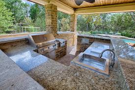 outdoor kitchen with sink, grill