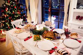 This one is probably one of the most popular dishes at christmas because it is usually the main course! Christmas Meal Laid On Table In Decorated Dining Room Stock Images Page Everypixel