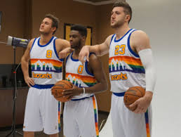Nuggets owner josh kroenke poses with dikembe mutombo's rainbow skyline jersey, a style the nuggets will temporarily bring back in their home opener saturday. Nuggets Pose In Rainbow Skyline Throwbacks To Promote Opening Night Thescore Com