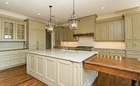 Khaki Colored Kitchen With White Marble Counters Large Center Island And Kitchen Island Dining Table Kitchen Island And Table Combo Kitchen Dining Room Combo