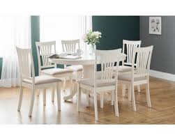 At the smaller size, the round dining table seats 4 people with a beautiful smooth, white lacquered finish. White Round To Oval Extending Dining Table 4 Chairs Your Comforts