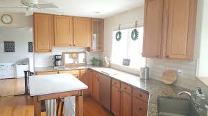 It's a lot easier and you don't need help from a professional. Update A Kitchen W Out Painting Oak Cabinets Growit Buildit