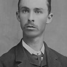 Vernon Bailey holding a wild beaver just removed from a live trap in...
