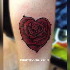 Heart designs can be worn in different places and various color shades can also be used to express the intricacy of the design. Heart Shaped Blooming Rose Tattoo Inkbyrafael Com Chest Piece Tattoos Heart Tattoo Tattoos