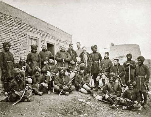 Photograph of a group of Afghan prisoners with a Sikh escort, taken by John Burke in 1878.