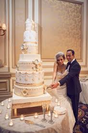 Fancy That Events White And Gold Wedding Cake Grand Cake Sugar Flowers Gold Cake Stand Rena White And Gold Wedding Cake Gold Wedding Cake Gold Cake Stand