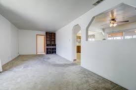 The coffee table is about 24″ x 48.. Alternate View Of Living Room With Built In Shelving And Wall Cut Out Into Formal Dining Room And Kitchen The Sister Team