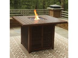 First and foremost, the fire tables that serve as the focal points of these arrangements offer the warmth. Signature Design By Ashley Paradise Trail Square Bar Table With Fire Pit Royal Furniture Outdoor Fire Pits