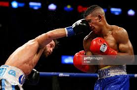 Chris Algieri lands a right to Erick Bone of Ecuador during their... News  Photo