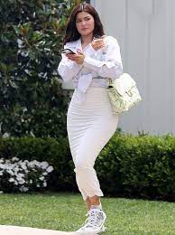 Kylie jenner street style in a pointy black pumps stepping out for lunch at her favorite mexican spot, summer 2020. Kylie Jenner White Midi Skirt All White Summer 2020 On Sassy Daily Kylie Jenner Dress Kylie Jenner Outfits Kylie Jenner White Dress