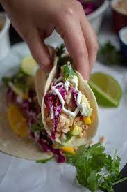 This easy shrimp tacos recipe is made with zesty shrimp, cilantro lime coleslaw, sliced avocado and a spicy chipotle crema. Fish Tacos With Lime Crema Cardamom Coconut