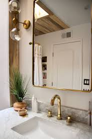 Black and white tile — it's so classic and timeless. Before And After Black And White And Wood And Gold Bathroom Ramshackle Glam Gold Bathroom Black And Gold Bathroom Gold Interior Design