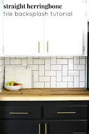 The way the herringbone backsplash complements the straight lines and the delicate curves the backsplash can feature the same color as the cabinetry and even the walls. Straight Herringbone Tile Backsplash Tutorial Kitchen Wall Design Herringbone Tile Backsplash Herringbone Tile