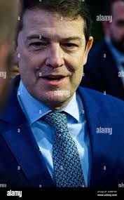 The president of Castilla y León, Alfonso Fernández Mañueco (r), signs  after a meeting to address the single EBAU,