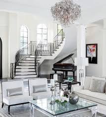 This Striking Black And White Living Room Is Grounded By An Arched Black Door And Black And White Living Room Decor White Living Room Decor Luxury Living Room