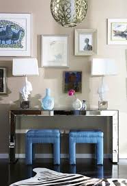 Entrances Foyers Mirrored Console Table White Shell Lamps Blue Silk Tufted Ottomans Zebra Cowhide Home Decor Inspiration Mirrored Console Table Foyer Design