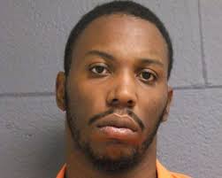 Triple homicide suspect will stay in jail amid federal gun case