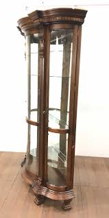 Check out our curved glass cabinet selection for the very best in unique or custom, handmade pieces from our buffets & china cabinets shops. Lot Pulaski Furniture Illuminated Curved Curio Cabinet