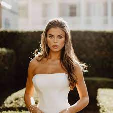 To enhance interest in both the front the front pieces are tucked back and secured with some flowers while the rest of the hair is allowed to flow freely. 41 Gorgeous Half Up Half Down Wedding Hairstyles
