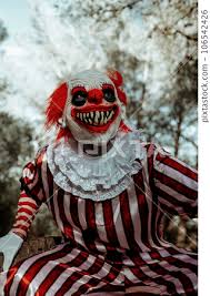 evil clown with a creepy smile a in the ...