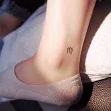 Looking For A New Tattoo For Summer Consider An Ankle Tattoo You Can Show Off All Season Long Virgo Tattoo Virgo Tattoo Designs Trendy Tattoos
