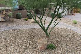 Stacking very large rocks creates a very interesting and wild looking yard area. Rock Bella Terra Landscapes
