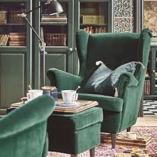 The Unmistakable Shape Of A Strandmon Wing Chair Complete With A Matching Dark Green Footstool Chosen He Green Chair Living Room Living Room Chairs Armchair