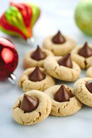 I remember my grandmother making these cookies every christmas, but i think i remember her placing a hershey kiss on the top of the cookies during the last few minutes of baking. Classic Peanut Butter Kiss Cookies Recipe Jessica Gavin
