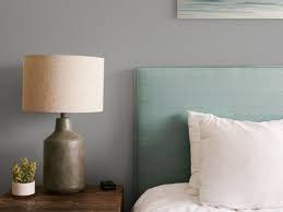 The colour theme continues throughout the room, with grey walls complementing bedside furniture. Beautiful Gray Living Room Ideas