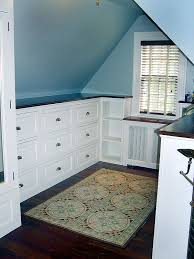 The sloped ceiling, textured wallcovering and platform beds of this attic bedroom evoke the feeling of sleeping in a tent, an especially luxurious one. 20 Clever Storage Ideas For Your Attic Hative