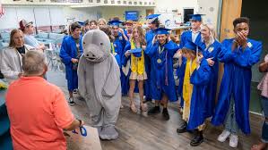 High school grads return to Mason Elementary School in St. Augustine