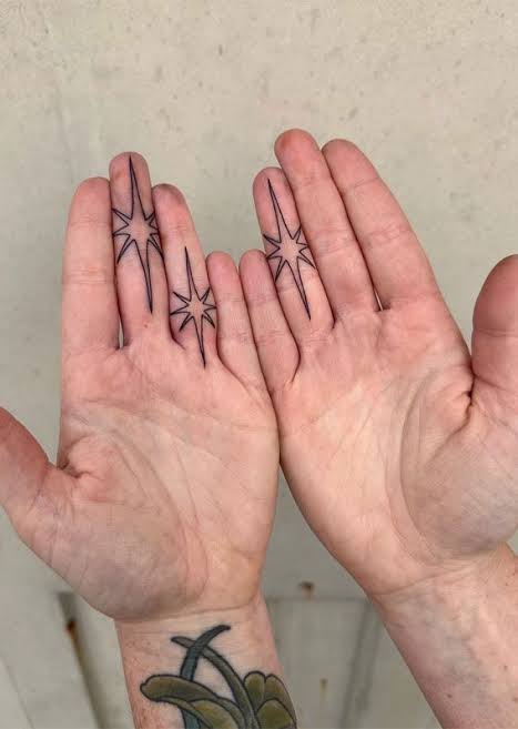 Minimalist Starburst Finger Tattoos : Celestial Charms 20+ Star Tattoo Designs