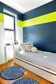 Designing a boy's room is not a task for the faint of heart! With Crisp White Walls And Warm Wood Floors This Manhattan Home Becomes The Perfect Backdrop For D Boys Room Wall Color Kids Bedroom Wall Color Boy Room Paint