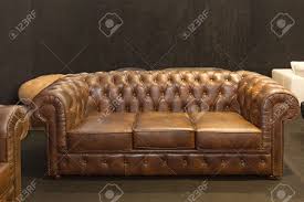 You can't go wrong with a leather sofa, beautiful. Brown Leather Classic Style Chesterfield Sofa In Dark Room Stock Photo Picture And Royalty Free Image Image 159196598