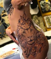 Thigh is perfect place to have a lioness tattoo. Lion And Flowers Tattoo On Women Thigh Tattoo Designs For Women