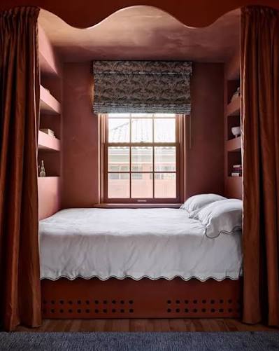 The cocoon bedroom is one of 2026's standout design trends—designed to envelop you in comfort and calm. Think soft textures, warm muted colors, and layered upholstery that turn your bedroom into a