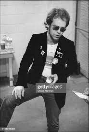 Portrait Of British Musician Elton John As He Eats An Apple Elton John British Musicians Elton John Costume
