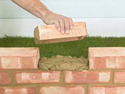 Those leftover bricks are perfect for creating a lovely informal walkway or path to your door. Plan On Doing This Project Over A Couple Of Weekends Lay The Footings For The Wall And Allow It To Dry For Brick Wall Gardens Brick Garden Brick Garden Edging