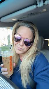 enjoying iced espresso while picking blueberries