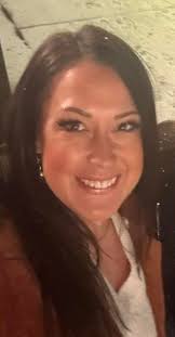 I want to turn this photo into a headshot. Can someone remove the  snowflakes from my hair and change the background to something  professional.