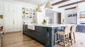 Dark wood cabinets with a blue kitchen island. Our Favorite Blue Kitchen Cabinet Paint Colors Christopher Scott Cabinetry