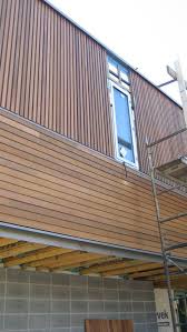 Modern Cedar Horizontal Wood Siding Home With Dark Shingles And Trim Horizontal And Vertical Wood Siding Options Vertical Wood Siding Vertical Wood Cladding
