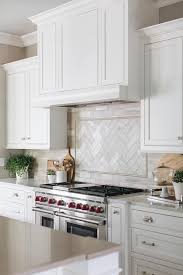 This rustic wooden range hood matches exposed wooden beams in the kitchen, too. White Kitchen Wood Range Hood Instaimage