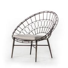 A Playful Twist On Classic Rattan Open Iron Weave Lends An Airy Yet Substantial Feel To A Sun Burst Shap Lounge Chair Outdoor Occasional Chairs Outdoor Chairs