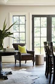 To paint a window frame without masking the glass, hold a loaded tapered trim brush as shown and draw it. Flourish Design Style Jens Pick Black Doors Interior Windows French Doors Interior Doors Interior